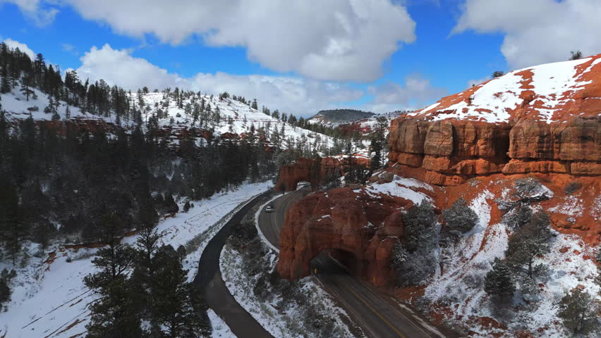 Aerial View Of Road Tunnel, Rock Formations And Snowy Mountains In Bryce Canyon National Park, Utah, USA.