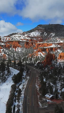 Vertical View Of Scenic Road Along The Pine Tree Forest And Hoodoos At Bryce Canyon National Park In Winter In Utah, USA. - aerial