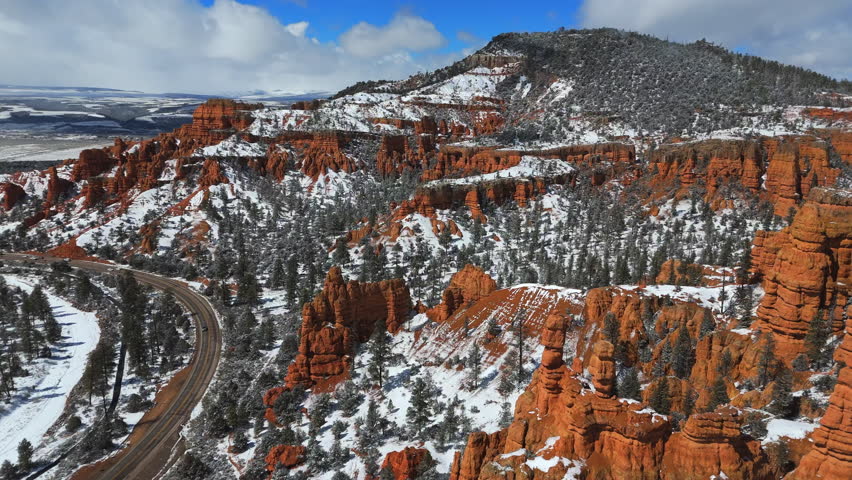 Snowy Landscape Of Bryce Canyon National Park With Hoodoos And Red Canyons In Utah, USA. - aerial shot