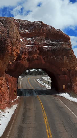 Road Tunnel Carved Through Red Rock Formations - Scenic Byway 12 In Utah, USA. - aerial shot