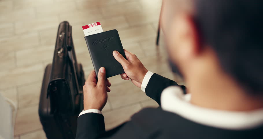 Business travel, airport and person with passport, employee and document for immigration or walking. Commuting, man and luggage for international trip, above and traveller with permit for destination