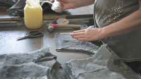 Craftsman shoemaker cuts out blanks from leather for making shoes. Shoemaking, handicraft, small business. - Powered by Shutterstock - Get 15% off with code: PIKWIZARD15