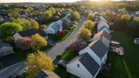 Wifi animation over modern American houses in spring. Golden hour sunset with futuristic neighborhood. Wifi internet connected broadband in suburban town. Internet of things. Aerial. - Powered by Shutterstock - Get 15% off with code: PIKWIZARD15