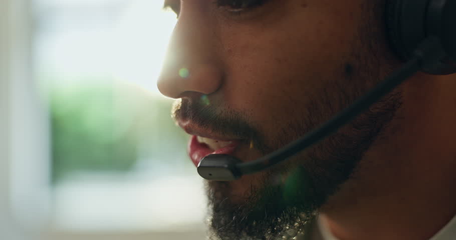 Mouth, mic and man talking at callcenter for customer service, advice or help desk consultant. Phone call, communication and closeup of agent with telecom, space and laugh with client for support