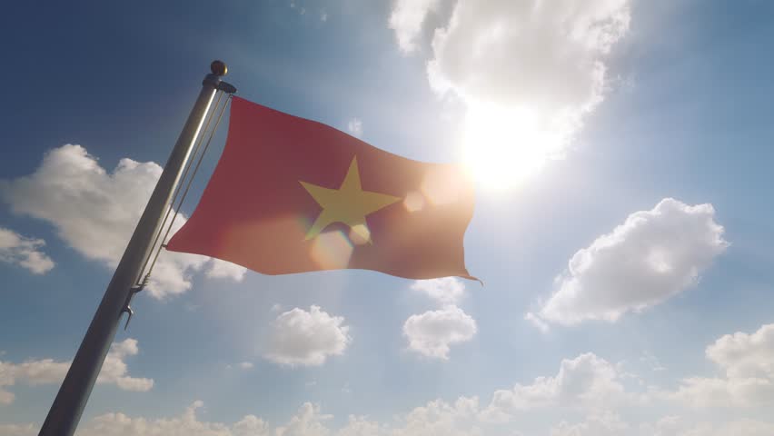 Vietnam Flag on a Flagpole with a cloudy blue sky background
