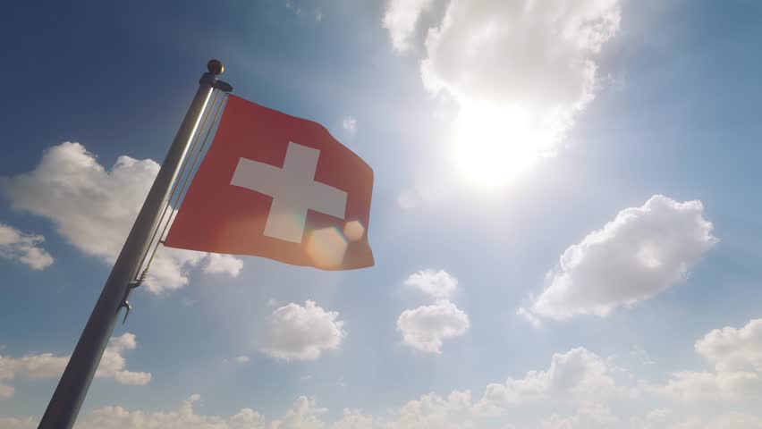 Switzerland Flag on a Flagpole with a cloudy blue sky background