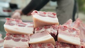 Selling pork meat at street market