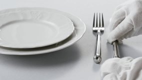 Elegant table setting with white tableware plates, cutlery, and glassware for a classy dining, fancy expensive restaurant dinner - Powered by Shutterstock - Get 15% off with code: PIKWIZARD15