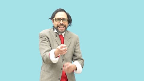 An untidy bizarre ridiculous man, wearing glasses, laughing out loud, over light blue background