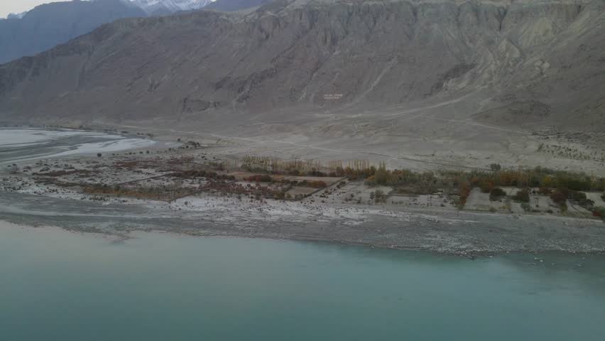 Aerial view of Indus River winding through mountains, Pakistan.
