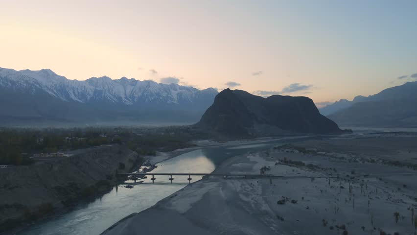 Aerial view of the Indus River winding through mountains, Pakistan.