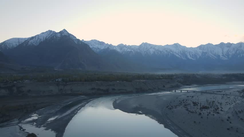 Aerial view of the Indus River in a snowy valley, Pakistan.