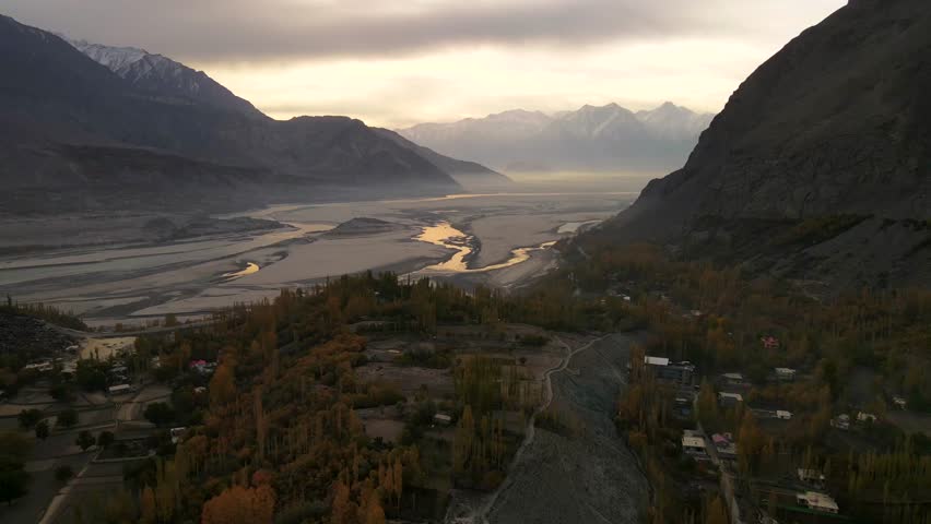 Aerial view of Indus River and mountains in autumn, Pakistan.