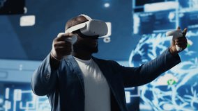 Black businessman using advanced technology VR headset tools to explore data science, automation and AI ethics in a digital data processing environment. Works on machine learning. Camera B. - Powered by Shutterstock - Get 15% off with code: PIKWIZARD15
