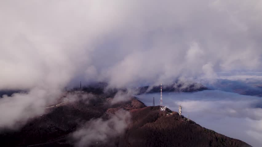 Aerial view of mountain landscape with clouds, Italy.