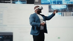 African american software developer uses virtual reality headset for coding, high tech interface workspace. Surrounded by terminal windows, representing digital programming culture. Camera A. - Powered by Shutterstock - Get 15% off with code: PIKWIZARD15