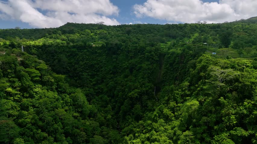 Aerial view of tropical waterfall in forest, Samoa.