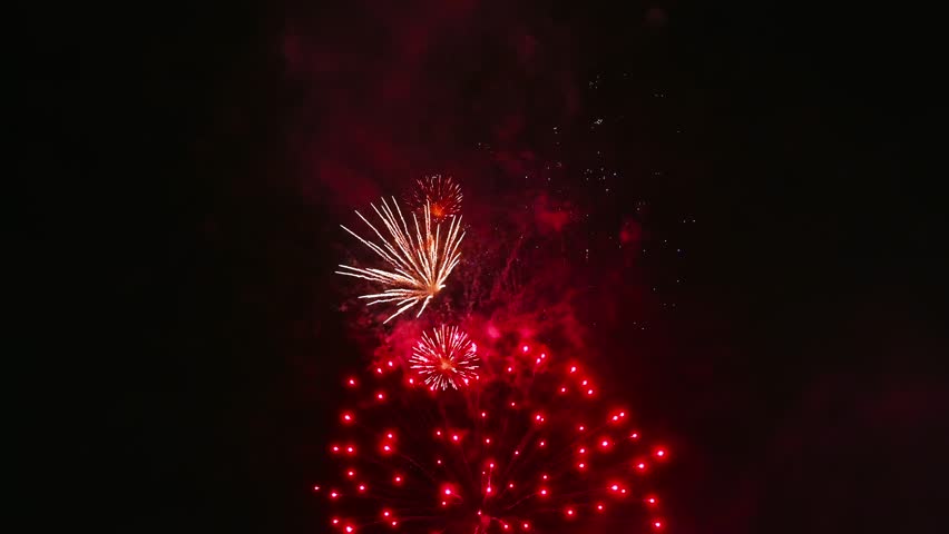 colorful festive fireworks display at the celebration of pyrotechnic show in night sky