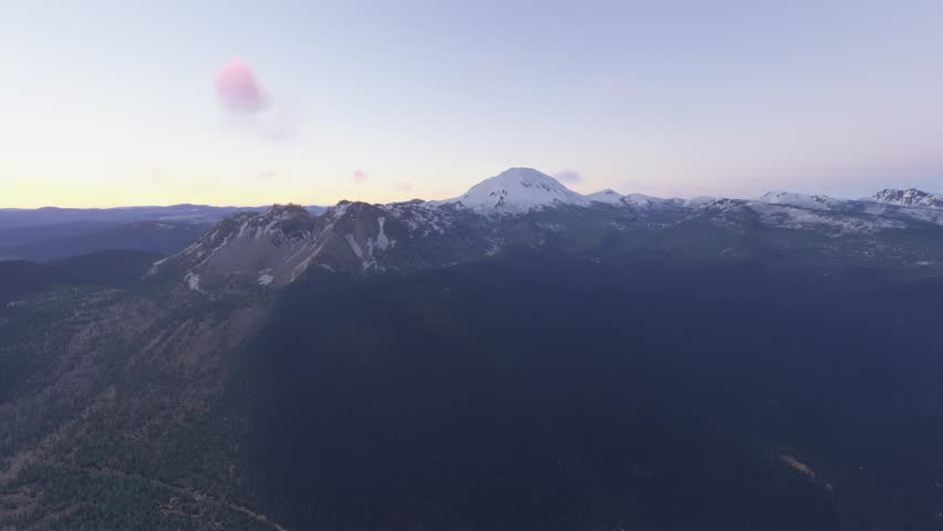 3D - Side aerial view at sunset with snow at Manzanita Lake in Lassen Volcanic National Park. California. United States