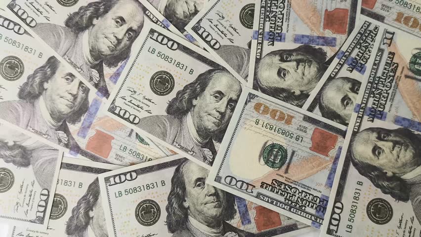 a bunch of scattered dollar bills