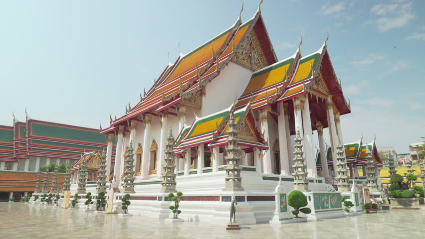 Awesome view of Wat Suthat Thepwararam in Bangkok, Thailand. The Buddhist temple is a landmark of Bangkok and a popular tourist attraction of Thailand.