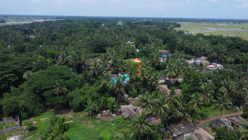 Indian village aerial view with old houses and temple with pond. Rural india.	