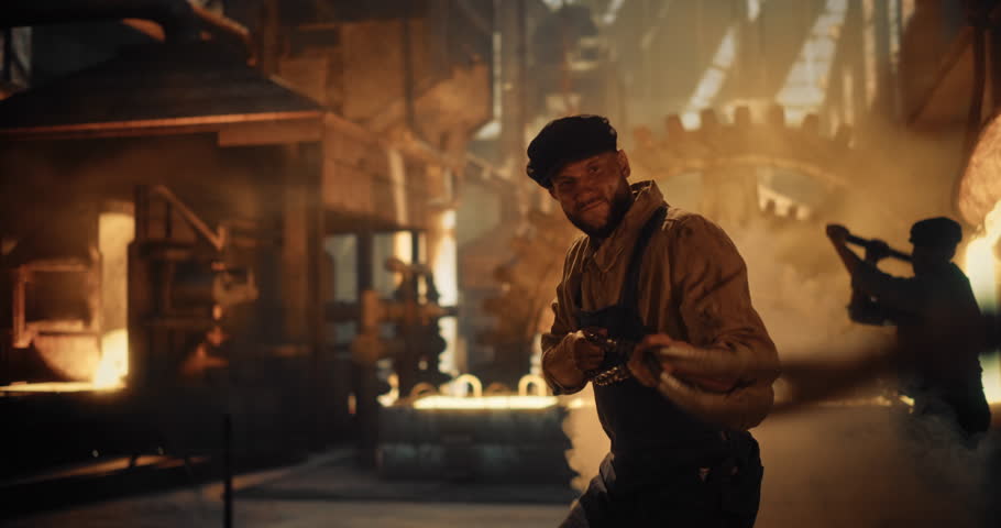 Industrial Workers at an Historical Iron Foundry Handle Molten Metals with Primitive Tools. Man is Pulling a Chain. Smoky, Intense Atmosphere Lit by Orange Glow of Industrial Furnaces