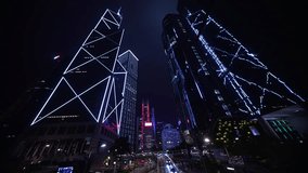 Skyscrapers Illuminated at Night Showcasing Modern Architecture and Vibrant City Life in a Bustling Urban Environment. Central Business District, Revealing Urban Financial District Brilliance - Powered by Shutterstock - Get 15% off with code: PIKWIZARD15