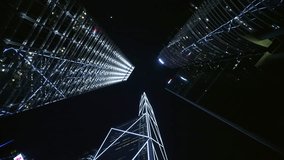 Central Business District. Illuminating Skyscrapers Rising Against Dark Nighttime Sky. Vertical View Capturing Urban Architectural Grandeur And Financial District Brilliance. Skyscrapers At Night Seen - Powered by Shutterstock - Get 15% off with code: PIKWIZARD15