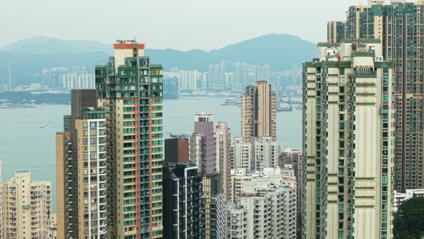 High-Rise Residential Buildings Dominate Hong Kong Skyline. Urban Sprawl, Showcasing Dense Residential Architecture And Modern City Living. Representing City