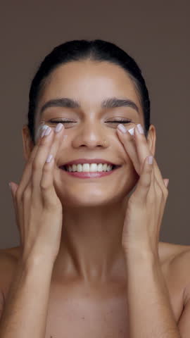 Skincare, happy and face of woman with cream for moisturizing, anti aging and hydration in studio. Dermatology, salon and portrait of person with lotion cosmetics for beauty, wellness and health