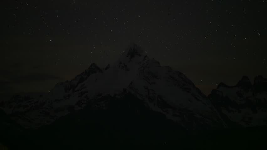 Yunnan, China - 16th June 2025 - Majestic Meili Snow Mountain under moonlight at Night