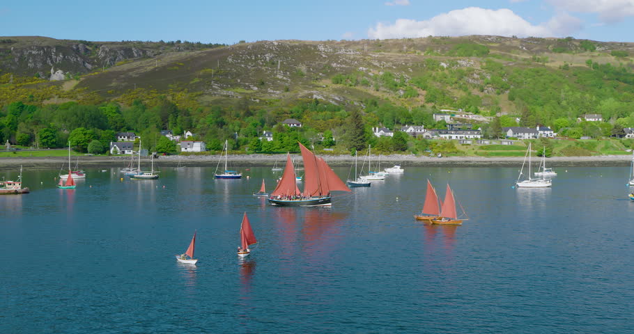 Drone captures Ullapool Lugger Fest with luggers cruising Loch Broom in the Highlands