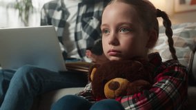 Caucasian family problem at home sad lonely boring child kid girl daughter hugging Teddy Bear suffering lack of attention multitasking freelancer mother working laptop talking phone writing notes - Powered by Shutterstock - Get 15% off with code: PIKWIZARD15