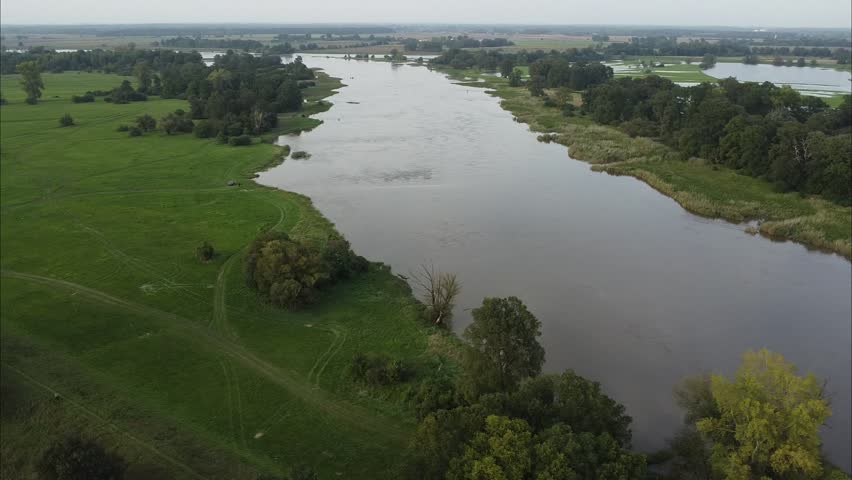 Aerial drone footage of the 2024 flood in Głogów County, Poland. Shows submerged areas, overflowing rivers, and the dramatic impact of the natural disaster on the region.