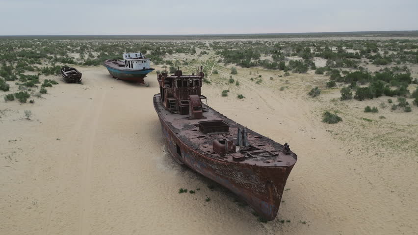 View of shipwrecks and town show distance from water today. Desert has swallowed the old port, and the sea is now dozens of kilometers away.