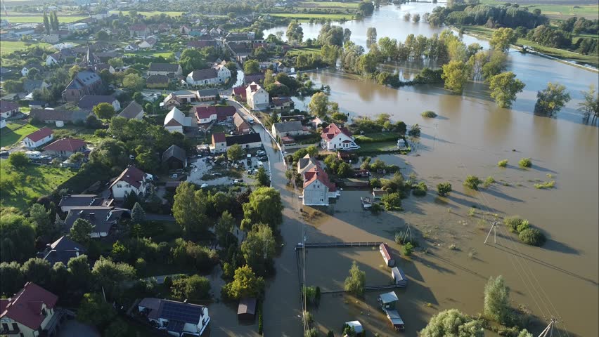 Aerial drone footage of the 2024 flood in Głogów County, Poland. Shows submerged areas, overflowing rivers, and the dramatic impact of the natural disaster on the region.
