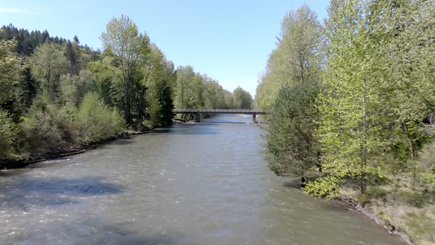 Cars Driving On The Bridge Over Green River In Auburn, Washington, USA. - aerial shot