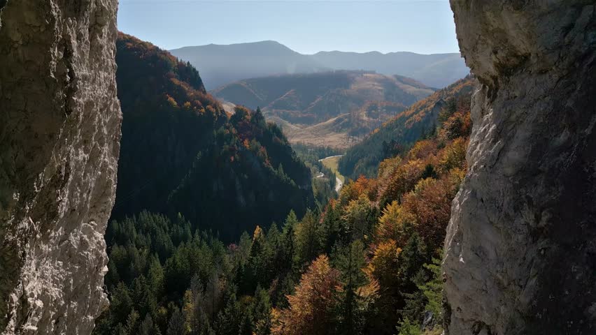 Flying Between Rocky Window Cliffs into Colorful Autumn Forest Nature