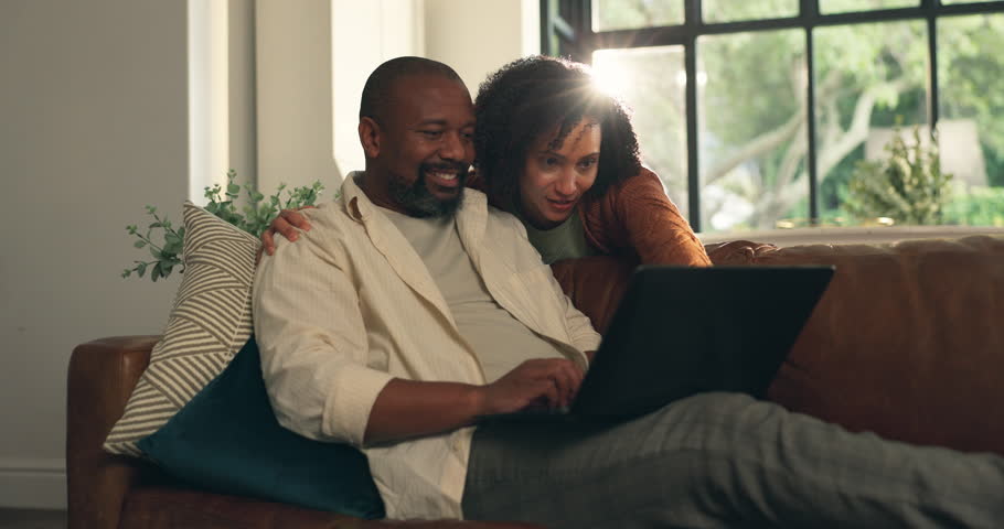 Laptop, relax and couple on sofa in home for holiday planning, research and flight ticket website. Tech, lounge and African man with woman for online review, hotel booking or travel blog for vacation