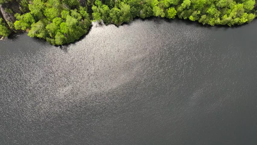 Drone reveal of mountain side near Chapel Pond Lake
