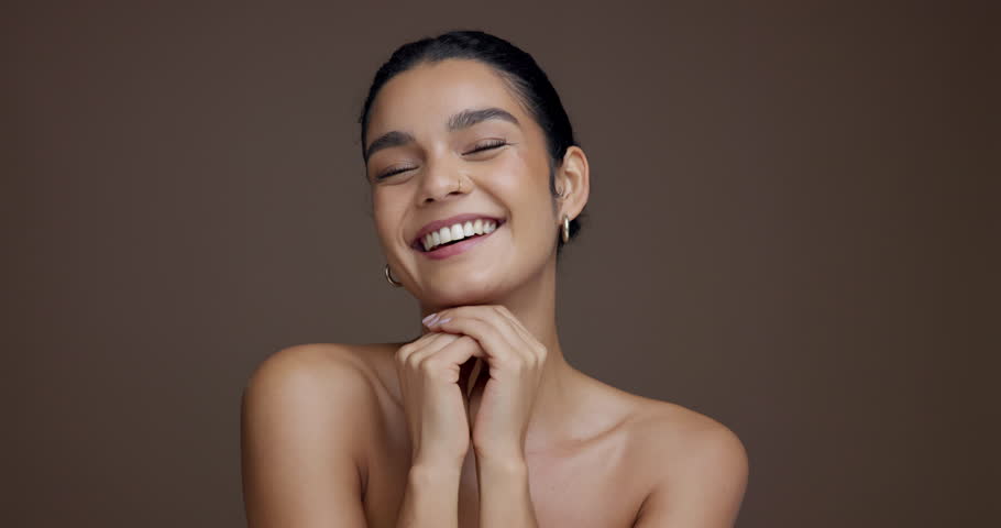 Face, confident and woman with smooth skin, bodycare and beauty with treatment for glow or cosmetic. Studio background, self care and person with pride for skincare, mockup space and dermatology