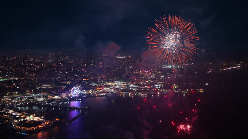 Aerial view shows vibrant fireworks lighting up the sky over San Francisco on July 4 Independence Day in California USA creating a festive summer atmosphere with colorful explosions and celebration