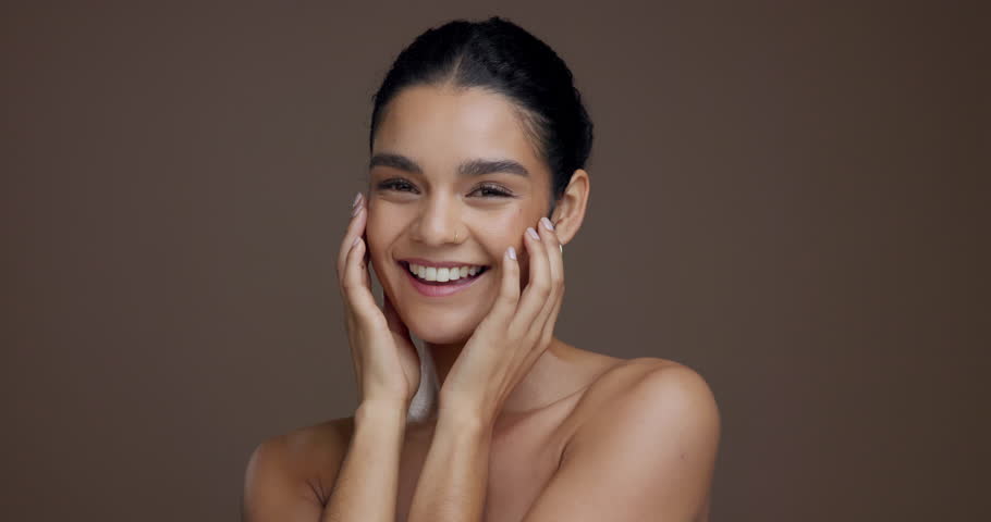 Face, confident and woman with smooth skin, glow and bodycare with cosmetic for beauty or treatment. Studio background, self care and person with pride for skincare, mockup space and dermatology