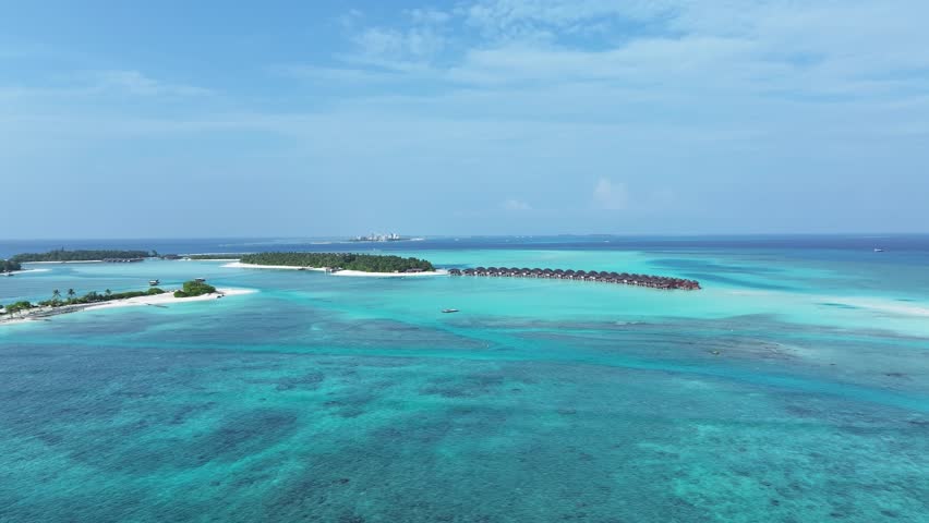 Aerial view of overwater bungalows, Maldives.