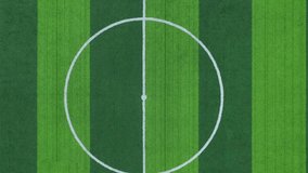 Soccer field center rotating clockwise from aerial perspective, revealing geometric lines and green turf texture from above - Powered by Shutterstock - Get 15% off with code: PIKWIZARD15
