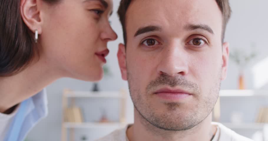 Chatty woman, talkative wife telling secret to man, husband, whispering at ear, family communication chatting, having fun, sharing hearing, rumor, good trust family relationship, new positive message