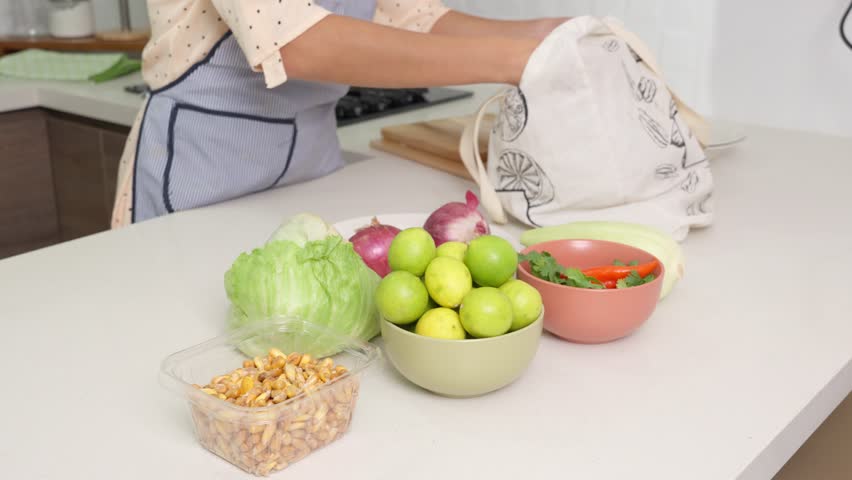 Professional chef unpacking fresh, vibrant ingredients from eco friendly bag, carefully selecting components for traditional peruvian ceviche preparation