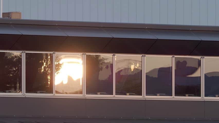 Reflection of the rising sun on Windows
