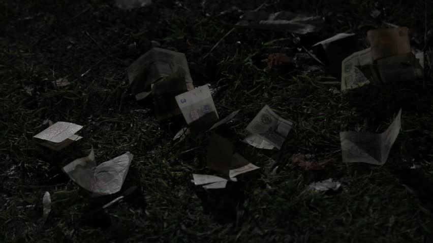 A montage showing money transactions. A person pays a bill at a bar, and a child's hands count old, historic Soviet ruble banknotes in an outdoor setting.